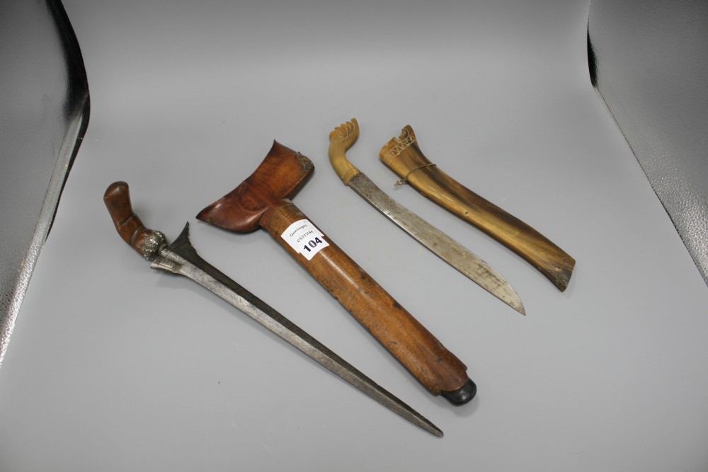 A Kris with hardwood handle and scabbard and another similar with horn scabbard